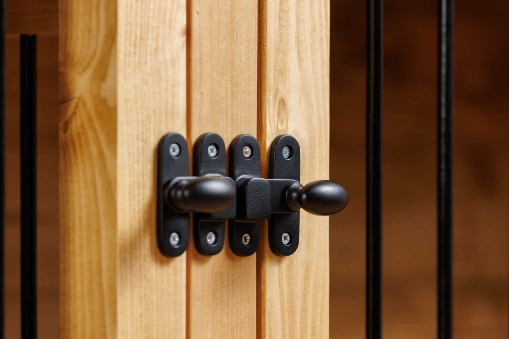close up of black ironmongery on furniture
