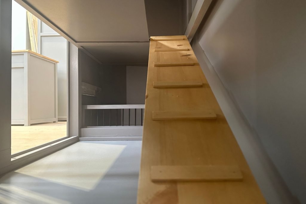 interior view of ladder leading up to upper level of rabbit home