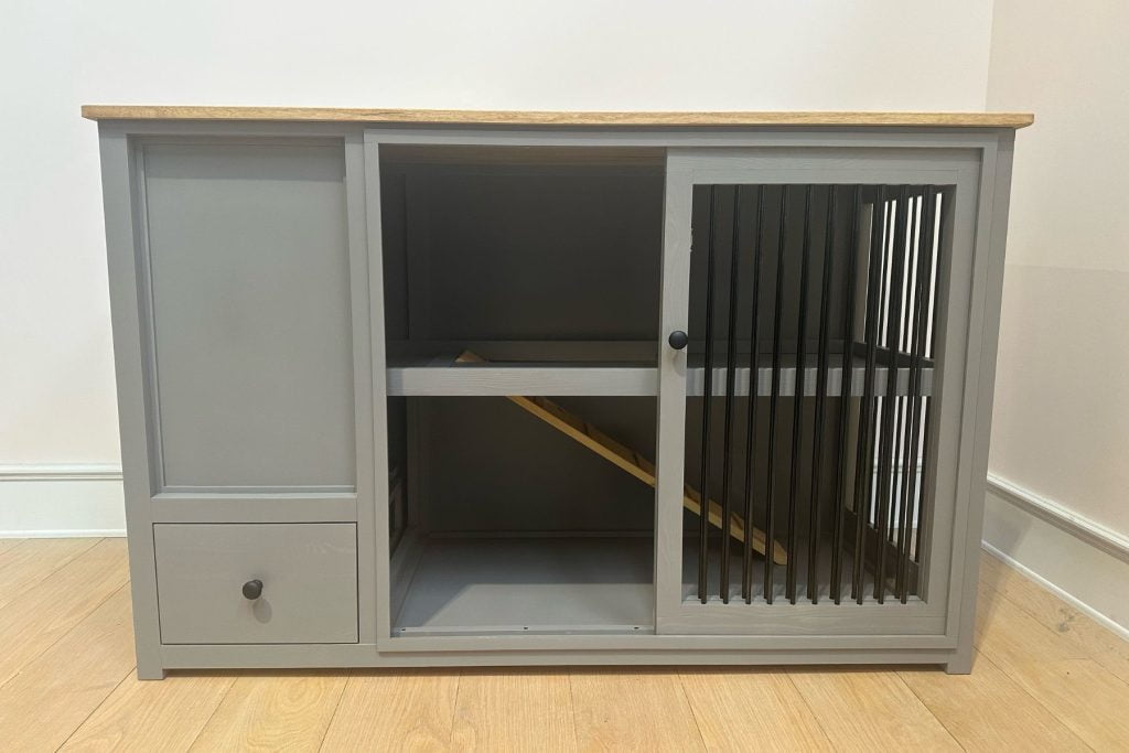 rabbit bedroom with hay feeder and bars at end