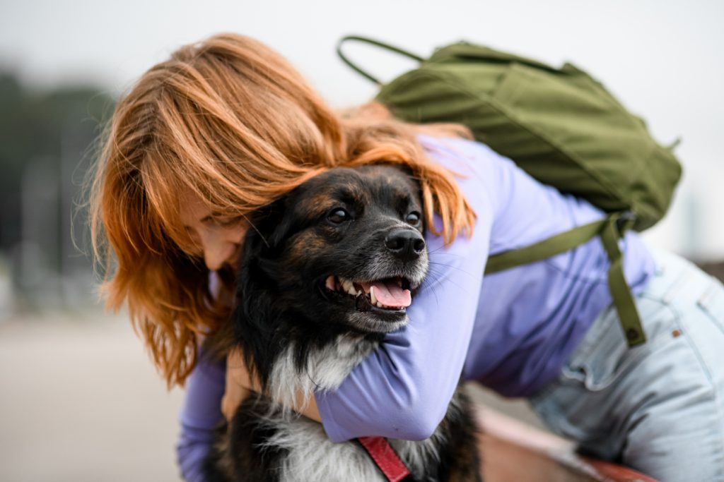 woman hugging rescue dog