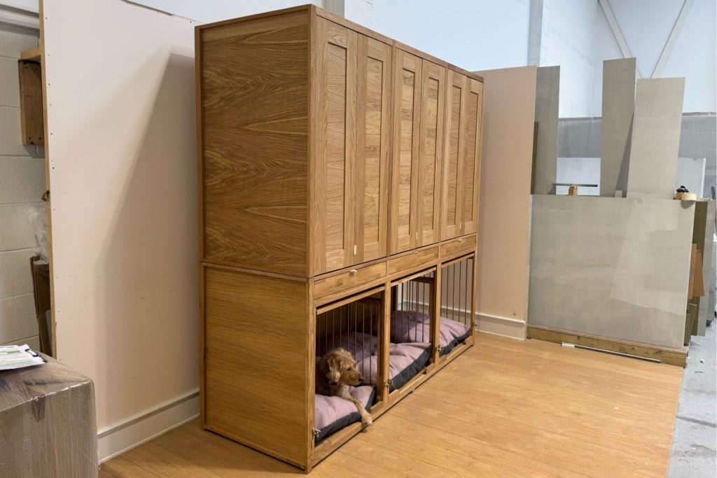 The final build of solid oak hallway furniture including three dog bedrooms, three drawers and three coat hanging cupboards