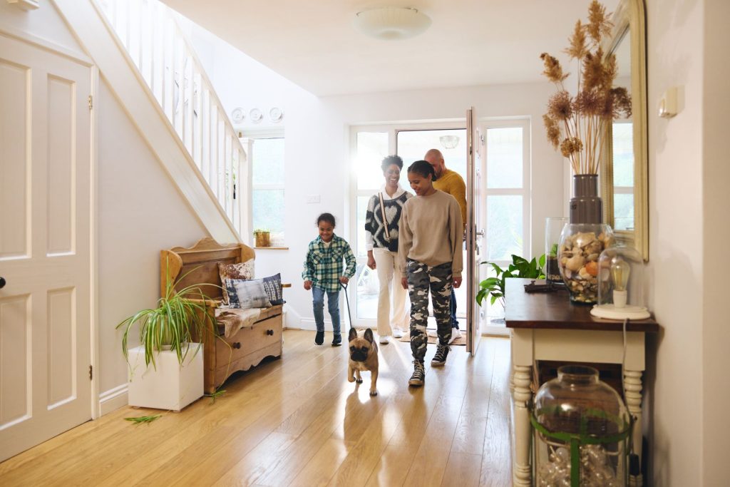 family in a beautiful home with a dog