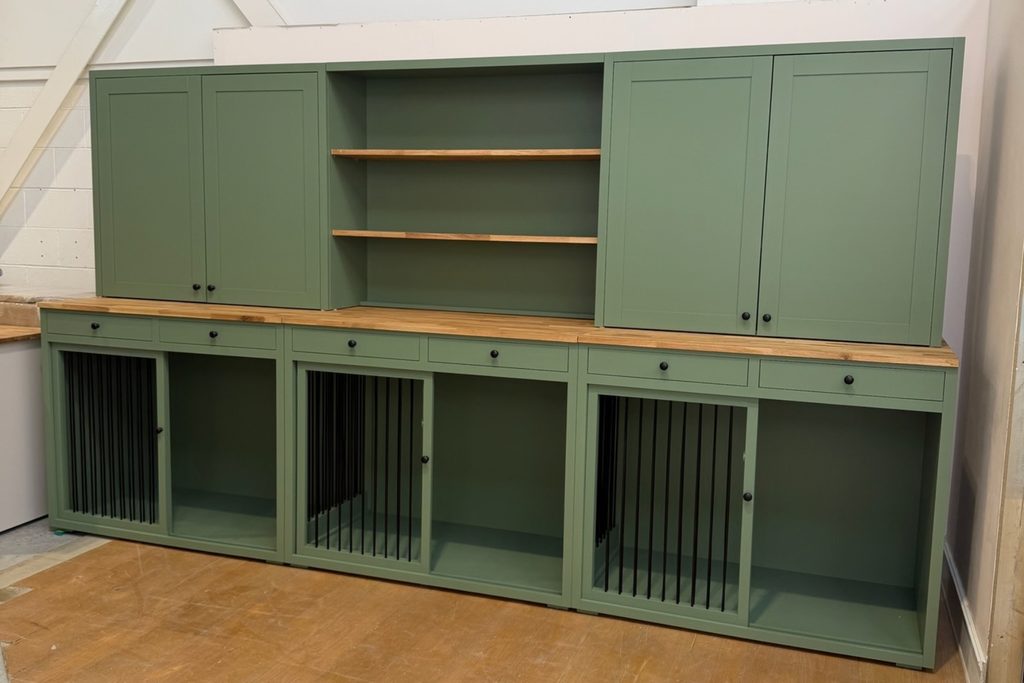 Breakfast Room Green triple dog crate dresser with solid oak worktop, three dog bedrooms with sliding barred doors, six drawers, two sets of tall double cupboards and central open oak shelving