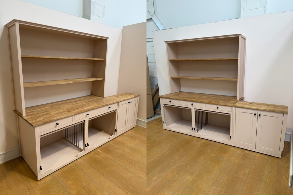 Fitted pale pink dog crate dresser with solid oak worktop and shelves, three drawers, two dog bedrooms with up and over doors and removable barred divider, and matching double cupboard